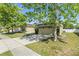 Charming single-story home with a well-maintained lawn, mature trees, and a front-facing garage at 5365 Dahlia Reserve Dr, Kissimmee, FL 34758