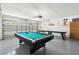 Finished garage has games including a billiards table and a foosball table for entertainment at 5365 Dahlia Reserve Dr, Kissimmee, FL 34758