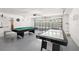 Finished garage has games including a billiards table and an air hockey table for entertainment at 5365 Dahlia Reserve Dr, Kissimmee, FL 34758
