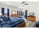 Bedroom with view to pool, featuring wood furniture and curtains at 5365 Dahlia Reserve Dr, Kissimmee, FL 34758