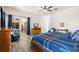 Bedroom with wood furniture and sliding doors to the outdoor area at 5365 Dahlia Reserve Dr, Kissimmee, FL 34758