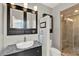 Modern bathroom with a granite countertop, a framed mirror and a tiled glass shower at 541 Campus St, Celebration, FL 34747
