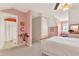 Cozy bedroom offers bright color scheme, en suite bathroom, and natural lighting at 541 Campus St, Celebration, FL 34747