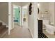 Hallway leading to a bathroom and bedroom with contrasting paint and decor at 541 Campus St, Celebration, FL 34747