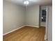 Open space with hardwood floors, neutral walls, a window, and a ceiling fan at 541 Campus St, Celebration, FL 34747