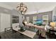 Open concept living space with a glass-top dining table, comfortable seating, and an inviting atmosphere at 541 Campus St, Celebration, FL 34747