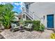 Charming brick patio area with comfortable seating and lush landscaping, perfect for outdoor relaxation and entertaining at 541 Campus St, Celebration, FL 34747