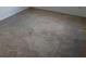 Cozy bedroom featuring neutral carpeting, white walls, and ample space at 567 Caribbean Dr, Davenport, FL 33897