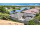 The backyard of this home features a large screened-in patio, a courtyard, and a serene lake view at 567 Villa Park Rd, Kissimmee, FL 34759