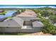 A beautiful home features a large screened-in patio, with private courtyard and lush landscaping at 567 Villa Park Rd, Kissimmee, FL 34759