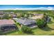 Spacious backyard with lush greenery, a screen enclosed patio and a private, peaceful setting at 567 Villa Park Rd, Kissimmee, FL 34759