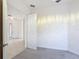 Carpeted bedroom with doorway leading to another room, featuring a chandelier light fixture at 567 Villa Park Rd, Kissimmee, FL 34759