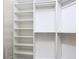 Organized walk-in closet with shelves and hanging rods for optimal storage solutions at 567 Villa Park Rd, Kissimmee, FL 34759