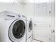 Convenient laundry room with modern, front-load washer and dryer units for efficient laundry care at 567 Villa Park Rd, Kissimmee, FL 34759