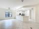 Bright living room featuring an open layout and a modern kitchen with stainless steel appliances at 567 Villa Park Rd, Kissimmee, FL 34759
