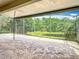 The screened-in lanai provides a tranquil outdoor space for relaxing and enjoying the serene lake view at 567 Villa Park Rd, Kissimmee, FL 34759