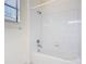 This bathroom offers a clean, well-lit shower with tiled walls and updated fixtures at 567 Villa Park Rd, Kissimmee, FL 34759