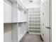 Walk-in closet with custom shelving and ample storage space at 567 Villa Park Rd, Kissimmee, FL 34759