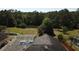 Aerial view of a house showcasing a screened-in pool and lush backyard at 624 Montana Ave, Davenport, FL 33897