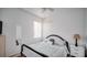 Comfortable bedroom featuring carpet floors, white blinds, neutral walls, and dark wood furniture at 624 Montana Ave, Davenport, FL 33897