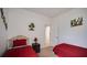 Bright bedroom featuring two twin beds, neutral carpet, and tropical decor at 624 Montana Ave, Davenport, FL 33897