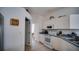 Efficient kitchen layout with white cabinets, blue countertops, and modern appliances at 624 Montana Ave, Davenport, FL 33897