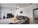 Cozy living room with vaulted ceilings, ceiling fan, tile flooring, and a view to bathroom at 624 Montana Ave, Davenport, FL 33897