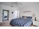 Serene main bedroom with ceiling fan, soft lighting, and a calming color scheme at 624 Montana Ave, Davenport, FL 33897