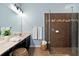 Modern bathroom with sleek vanity, glass-enclosed shower, and stylish tile work at 6886 Sundrop St, Harmony, FL 34773