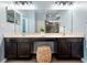 Well-lit bathroom with dual sinks, a spacious vanity, and a seamless glass shower providing a spa-like experience at 6886 Sundrop St, Harmony, FL 34773