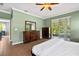Cozy bedroom with wood furniture with easy access to a back patio at 6886 Sundrop St, Harmony, FL 34773