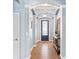 Elegant entryway with arched doorways and decorative console table at 6886 Sundrop St, Harmony, FL 34773