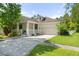 Charming single-Gathering home featuring a well-manicured lawn and a two-car garage at 6886 Sundrop St, Harmony, FL 34773