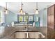 Kitchen with granite counters and a view into living and dining areas at 6886 Sundrop St, Harmony, FL 34773