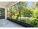 This screened porch provides beautiful views of the lush backyard at 6886 Sundrop St, Harmony, FL 34773