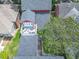 Aerial shot showcasing a house with a rooftop balcony with outdoor furniture at 715 Honeysuckle Ave, Celebration, FL 34747