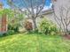 Backyard featuring lush greenery and well-maintained lawn at 715 Honeysuckle Ave, Celebration, FL 34747