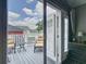 This balcony shows a view of the outdoor furniture and blue skies at 715 Honeysuckle Ave, Celebration, FL 34747