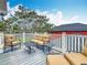 Comfortable outdoor seating on a spacious balcony with a view of the neighborhood at 715 Honeysuckle Ave, Celebration, FL 34747