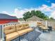 This balcony shows outdoor seating with lush trees and neighborhood views at 715 Honeysuckle Ave, Celebration, FL 34747