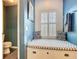 Cozy bathroom nook featuring window seat and stylish pillows at 715 Honeysuckle Ave, Celebration, FL 34747
