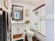 Bathroom features a shower with glass doors, a vanity and sink, and bronze fixtures at 715 Honeysuckle Ave, Celebration, FL 34747