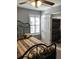 Cozy bedroom with natural light, featuring a decorative metal bed frame and ensuite bathroom at 715 Honeysuckle Ave, Celebration, FL 34747