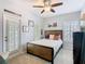 Bright bedroom with a comfortable bed, natural light, and access to the outdoor patio at 715 Honeysuckle Ave, Celebration, FL 34747