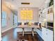 Cozy dining area with bench seating, decorative art and modern light fixture at 715 Honeysuckle Ave, Celebration, FL 34747