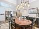 Stylish dining room with modern lighting, wainscoting, and a cozy rug, perfect for entertaining at 715 Honeysuckle Ave, Celebration, FL 34747