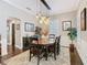 Stylish dining room with modern lighting, wainscoting, and a cozy rug, perfect for entertaining at 715 Honeysuckle Ave, Celebration, FL 34747