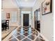 Elegant foyer featuring a striking tile pattern, ample natural light, and a welcoming ambiance at 715 Honeysuckle Ave, Celebration, FL 34747