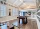 Large game room with hardwood floors, a loft space, and tons of wall decor at 715 Honeysuckle Ave, Celebration, FL 34747