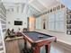 A game room showcases hardwood floors, with a loft, media, and an array of wall decor at 715 Honeysuckle Ave, Celebration, FL 34747